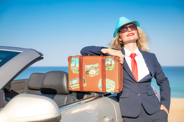 Successful young businesswoman on a beach