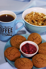 cup of coffee and cookies on table