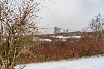 Winter in the south of Vienna - Recreational Area Wienerbergsee in front, and the construction site for the Biotope City and the Twin Towers in the background