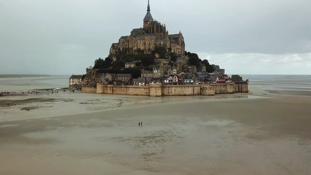 Aerial Pan Left to Right: Isolated Castle of Mont Saint Michael of France