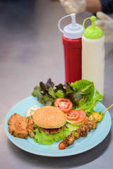 burger with french fries and salad