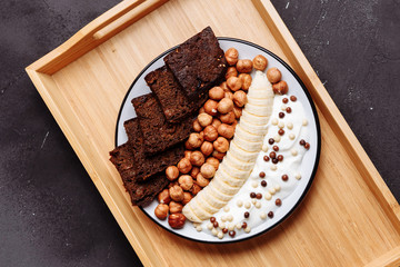 Closeup of plate with healthy food, Breakfast on wooden background, top view