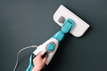 Steam cleaner mop on grey background. Top view, flat lay. Banner with copy space. Cleaning service concept