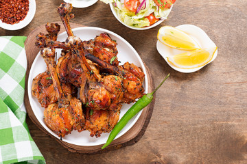 Grilled chicken legs with spices. Turkish Pirzola Kebab .