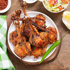 Grilled chicken legs with spices. Turkish Pirzola Kebab .