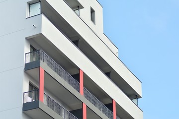 Modern apartment buildings on a sunny day with a blue sky. Facade of a modern apartment building