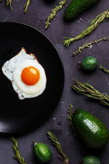 Rosemary, cumin, cucumbers, avocado, feijoa, eggs on the kitchen table. Healthy Breakfast, proper nutrition diet food