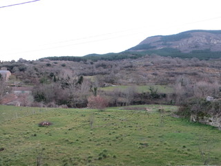 Fototapeta na wymiar View of a village with fields in the winter