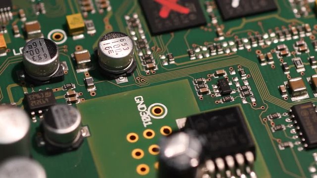 Rotating printed circuit board with microprocessors and capacitors.