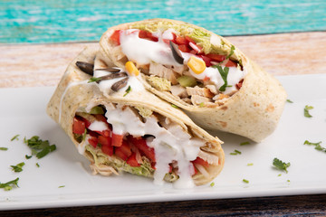 tasty wrap with chicken meat and greens