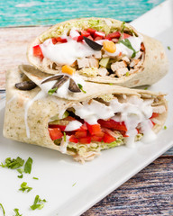 tasty wrap with chicken meat and greens