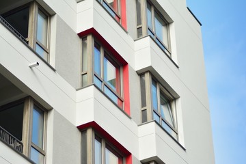 Modern apartment buildings on a sunny day with a blue sky. Facade of a modern apartment building