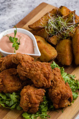 deep fried crispy chicken with fries and dipping sauce