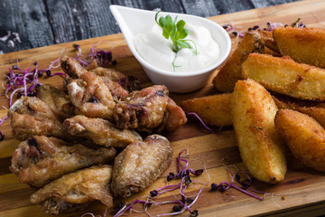 fried chicken wings with potato and dipping sauce
