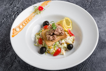 fresh healthy tuna salad appetizer on white plate