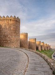 Obraz premium The magnificent medieval walls of Avila, Castile-Leon, Spain. A UNESCO World Heritage Site completed between the 11th and 14th centuries