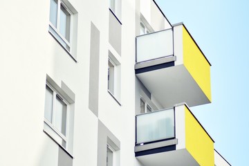 Modern apartment buildings on a sunny day with a blue sky. Facade of a modern apartment building