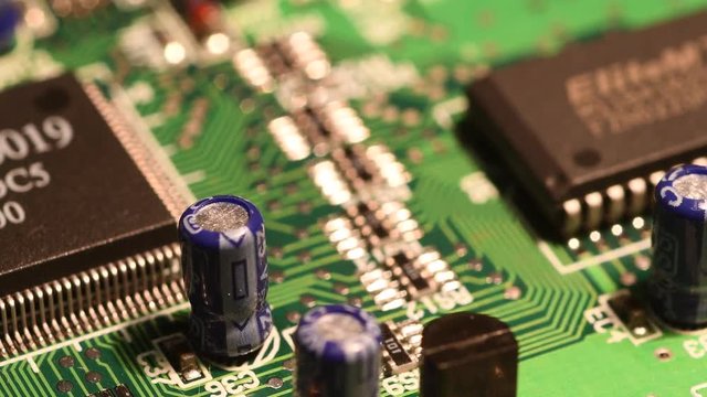 Rotating printed circuit board with microprocessors and capacitors.