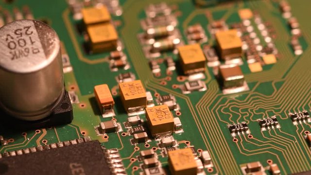 Rotating printed circuit board with microprocessors and capacitors.