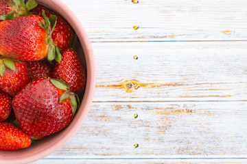 Sweet, juicy, ripe strawberries. Red, large strawberries in a pink cup. Food with vitamins. Vegetarian food.