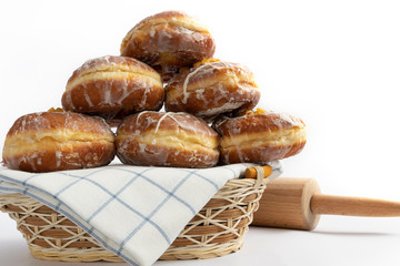 Tasty doughnuts with jam on white background. Fat Thursday decoration.