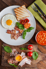 Fried eggs with bacon on breakfast