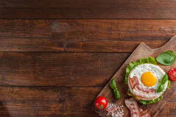 Fried eggs with bacon on breakfast