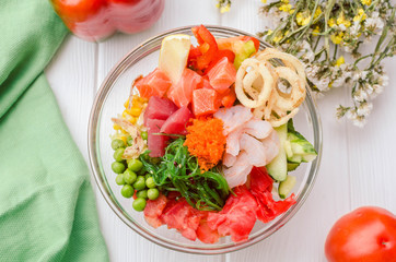 fresh poke bowl with tuna, salmon, flying fish roe