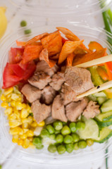 poke bowl with meat, fresh salad with chicken