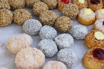 A lot of donut and strawberry jam