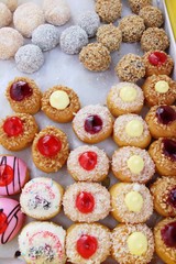 A lot of donut and strawberry jam