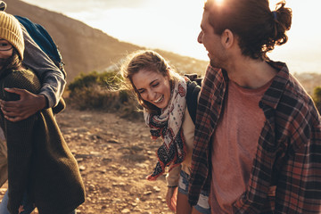 Young people having fun on hiking trip