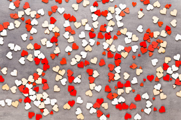 Happy Valentines day background. With small color hearts on gray background.