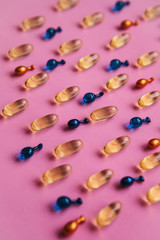 Capsule background with Omega 3, hyaluronic acid and coenzyme. Caring for the health of the skin and body.