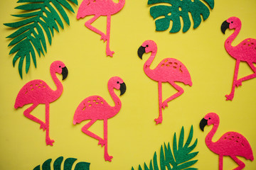 Obraz na płótnie Canvas Tropical summer bright background with many plant leaves and flamingos.