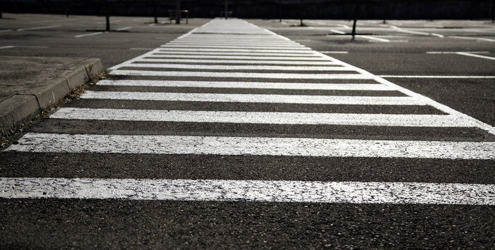 Step of petons on the asphalt