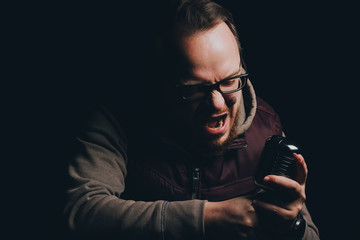 singer singing into vintage microphone