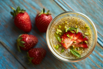 Fresh passion fruit cocktail with strawberries, close-up