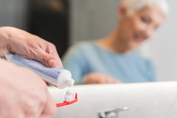 Female hands holding toothbrush