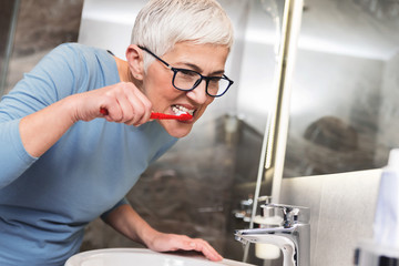 Woman washing her teeth