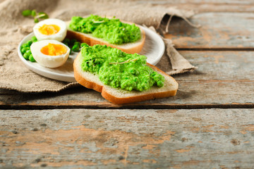 green peas, avocado and vegetable pate - sandwich (healthy food). food concept. top view