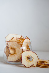 apple chips.Healthy snack.Healthy snack. Tasty dried apple and pear rings chips on light background 