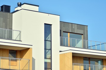 Modern apartment buildings on a sunny day with a blue sky. Facade of a modern apartment building