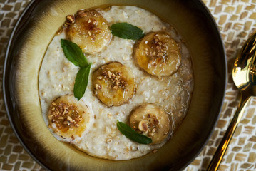 Healthy breakfast concept with oatmeal bowl and milk glass