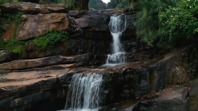 View of the arch bridge and waterfall in the evening. Sri Lank Island
