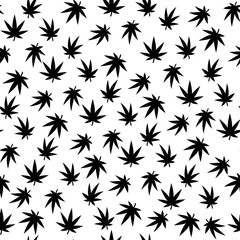 Seamless vector pattern. A lot of cannabis leaves. Black on a white background. © Irina Morozova
