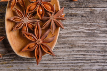 anise stars on a dark rustic background - Image
