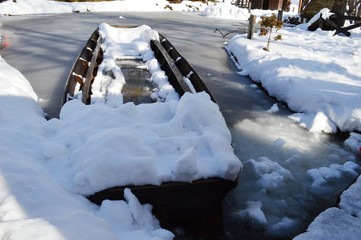 a boat in the snow on a frozen lake