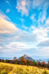 Fototapeta premium Clouds at the sunset on the Deva citadel