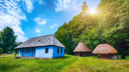 View of traditional romanian peasant houses in Transylvania, Romania.